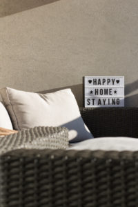 At home on the balcony, sign 'happy home staying' At home on the balcony, sign 'happy home staying'